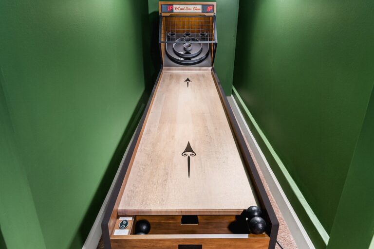 Game Room at Luxury 5BR Oasis in Atlanta, GA – yes, that's right, a full skee-ball lane tucked in the game room!